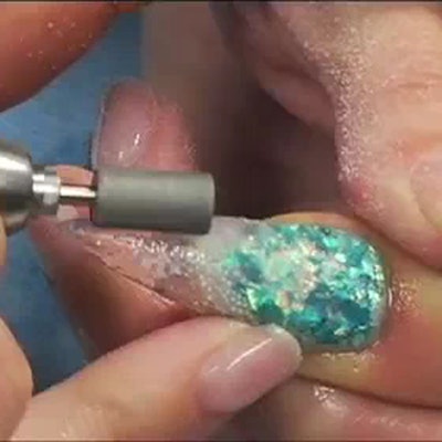 NEW YORK, NY – FEBRUARY 10: A model poses backstage with nails by CND for Jeremy Scott Fall/Winter 2017 on February 10, 2017 in New York City. (Photo by Jennifer Graylock/Getty Images for CND)