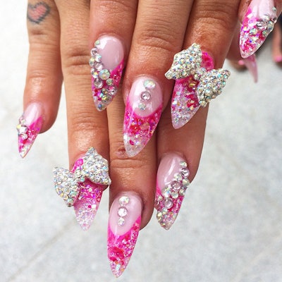 Pretty in pink and rhinestones! Manicure by @adoredollsparlour.