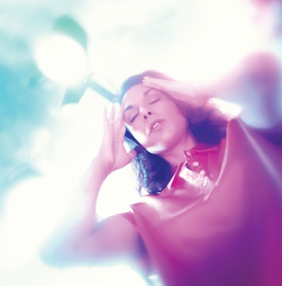 WOMAN EXPERIENCING DIZZINESS