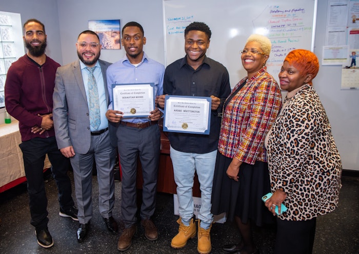 Left to Right: Mentor Terrance Henigan, His & Hers Barber School Owner, José Gardea, Sebastian Moore, Andre Whittington, His & Hers Barber School Instructor, Irene Youngblood, and Mentor Brenda Potts gathered to support the two graduates as they received their certificates last December in 2019.