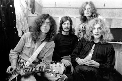 Led Zeppelin members all rocking long hairstyles.