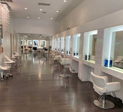 Stations are spaced 12 feet apart and utilize acrylic sheets to separate clients.