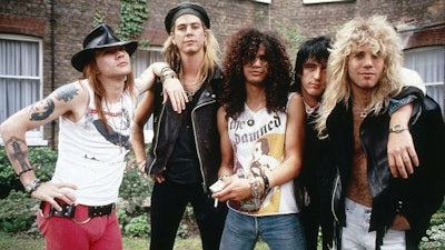 1980s big hair sported by a hair band.