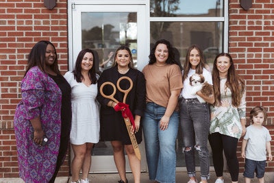 freecoat nails at the ribbon-cutting ceremony for the new location in Cornelius. Shown left to right: Melyssa Ryan, Staci McDonnell, franchise owner Mikayla Keep, studio manager Bailey Hicks, Alexis VanWallaghen and Jen Gardino.
