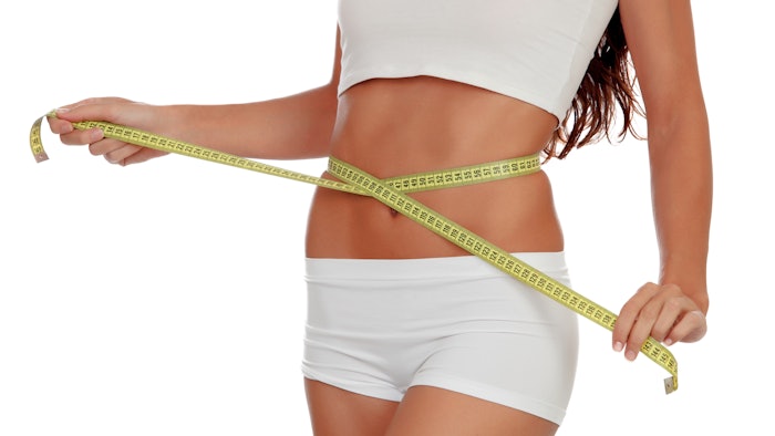 Girl with tape measure around her waist