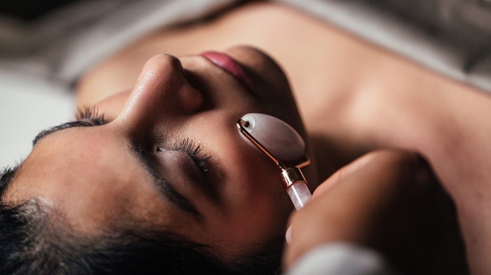 woman receiving holistic facial massage