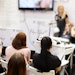 Attendees viewing a nail presentation