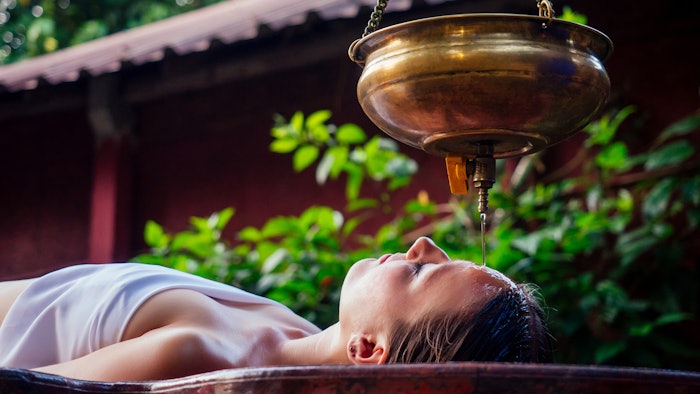 Ayurveda massage alternative healing therapy, the shirodhara treatment.