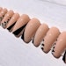 Press-on nail set with cut crease designs