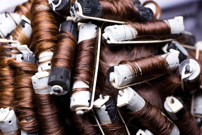 Perm rods creating a curly 80s look