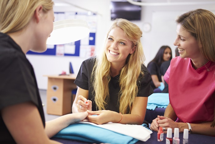 Nail technician training students.