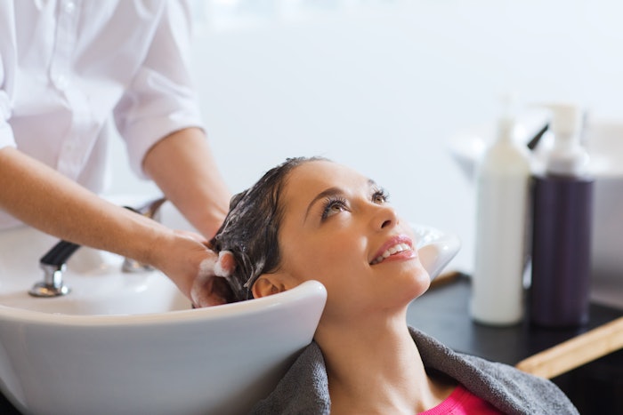 Happy client getting her hair done at a hair salon