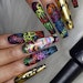 A graffiti-inspired nail set from Hispanic American nail artist Jose Cordova