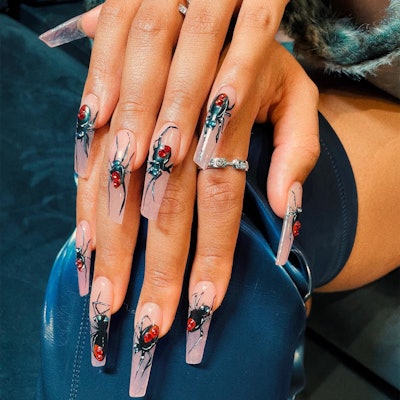 Megan Thee Stallion's spider nail art by Coca Michelle.