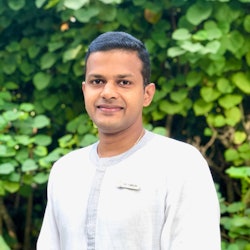 Dr Arun Tomson