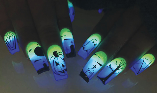 Glow in the dark Halloween nail art designed by Rebecca Ludwig