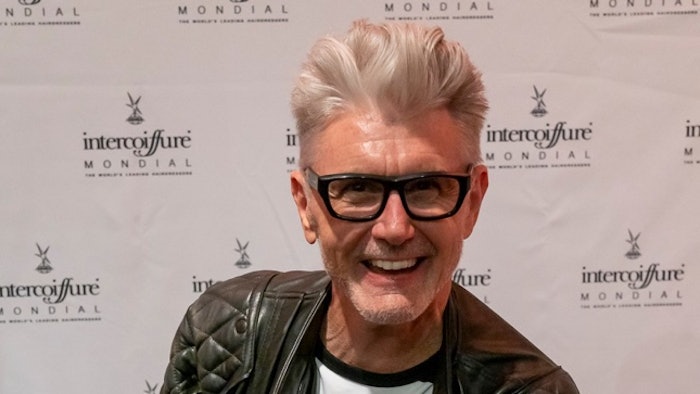 Professional beauty educator and John Paul Mitchell Systems artistic director Stephen Moody receives the Knight Award at Intercoiffure Mondial 2022.