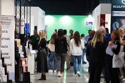 Attendees browse the convention floor at the Beauty and Wellness Congress in Italy