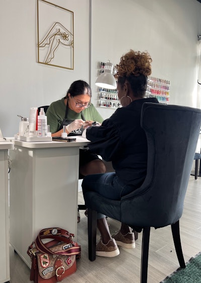 Anastasiia Rozdobutko servicing a client at Banana Nails in Chicago