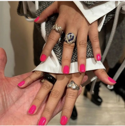 Camila Cabello presents her polished pink mani to her manicurist, Tom Bachik