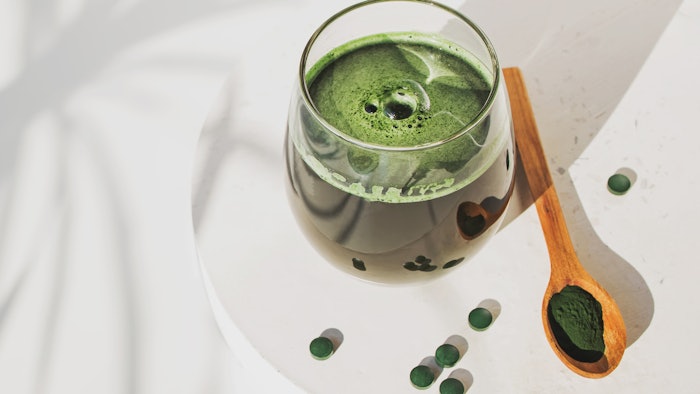 wellness drink with Spirulina or chlorella. Green food supplement.