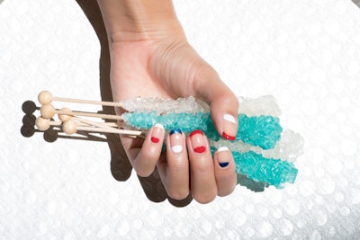 An abstract red, white and blue French manicure