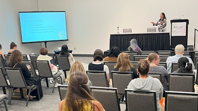 Jamerie Michalek, owner, massage therapist and spa coach, presents at Face & Body 2023.