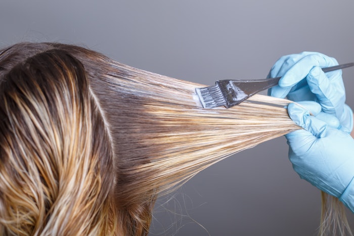 Hairstylist Kristeena Van Cleave shares her process for using color theory to transition a blue-green hair color to blonde.