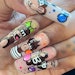 Get cartoon inspired nail inspo with these submissions from Nailpro's readers.
