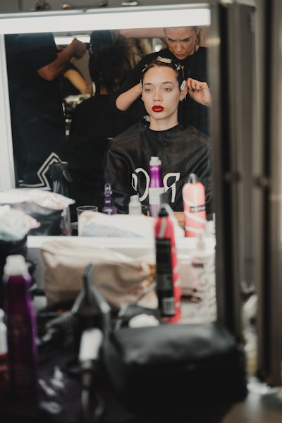 Renowned hair stylist Rutger (@rutgerhair) showcased his exceptional talent by using a curated selection of Uberliss hair care products to craft striking hair designs that complemented Caroline Hu's avant-garde fashion collection.