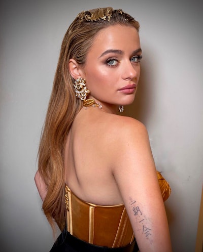 Joey King at the Schiaparelli event in Los Angeles with hair styled by Dimitris Giannetos.