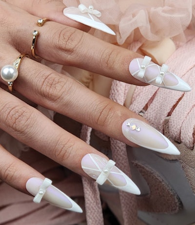 Taking a more contemporary twist on the balletcore trend was Tamara Di Lullo @tamaradilullo from the CND Global team. Di Lullo took the classic French up a notch with sculpted bows, pearls and rhinestones.