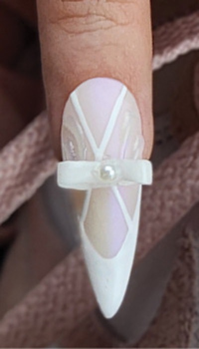 A closer look at the mini-bow balletcore nail art from Tamara Di Lullo.