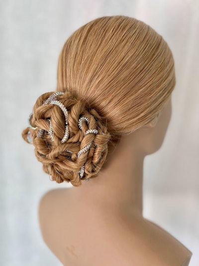 Hairstylist Anna Peters, owner of re:TREAT Color + Hair Design and Studio, is sharing a tutorial for a twisted bun that is best left to the pros.