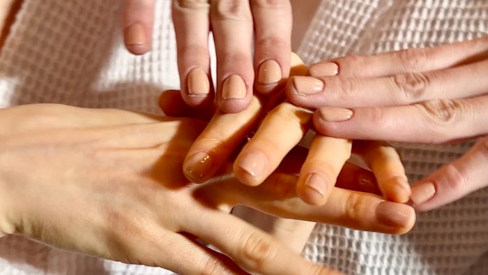 CND partnered with manicurist JinSoon to create unexpected opaque, neutral glossy nails for the Marc Jacobs FW24 Runway.