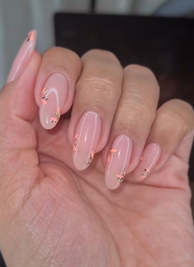 Nude nails with gold and peach accents
