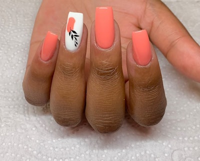 Peach colored nails with peach nail art as an accent nail