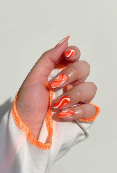 Peach and orange swirl nails