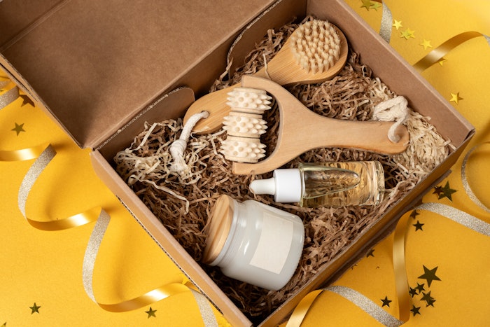 Body care products order online unboxing, beauty gift set serum, cream, massage brushes, candle or cream, new year christmas present