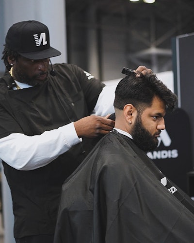 John Mosley educates on stage with ANDIS.