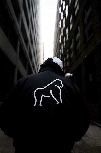 John Mosley wearing Popular Nobody merchandise.