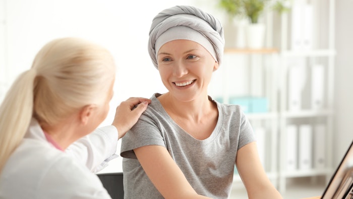 Esthetician helping her client who is battling cancer
