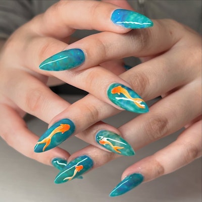Marbled water nails with goldfish nail art