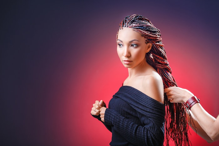Woman having her hair braided