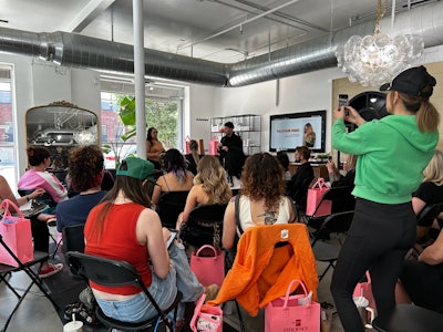 J Ladner educating with Oligo Pro about efficiency behind the chair.