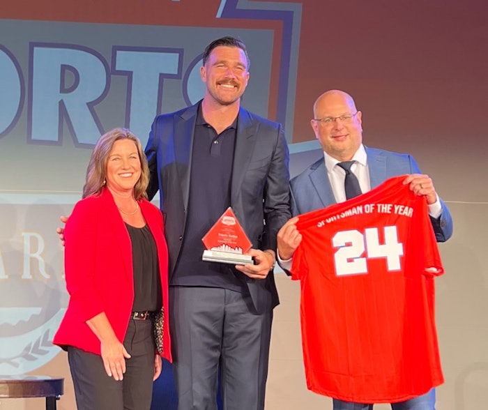 Travis Kelce accepting the Polsinelli Sportsman of the Year award at the Kansas City Sports Awards.