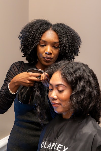 OLAPLEX's Regional Education Manager Coko Taft demos the brand's new Bond Shaper Curl Rebuilding Treatment.