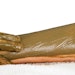 Hands rubbing a treatment on a leg