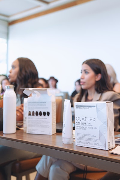 Olaplex Pro Collective members learning about the brand's new products and services.