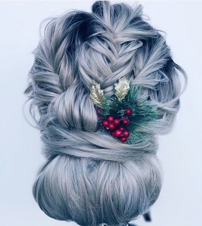 Grey/blue hair in a braided bun updo styled with holly by @caraleestyles.